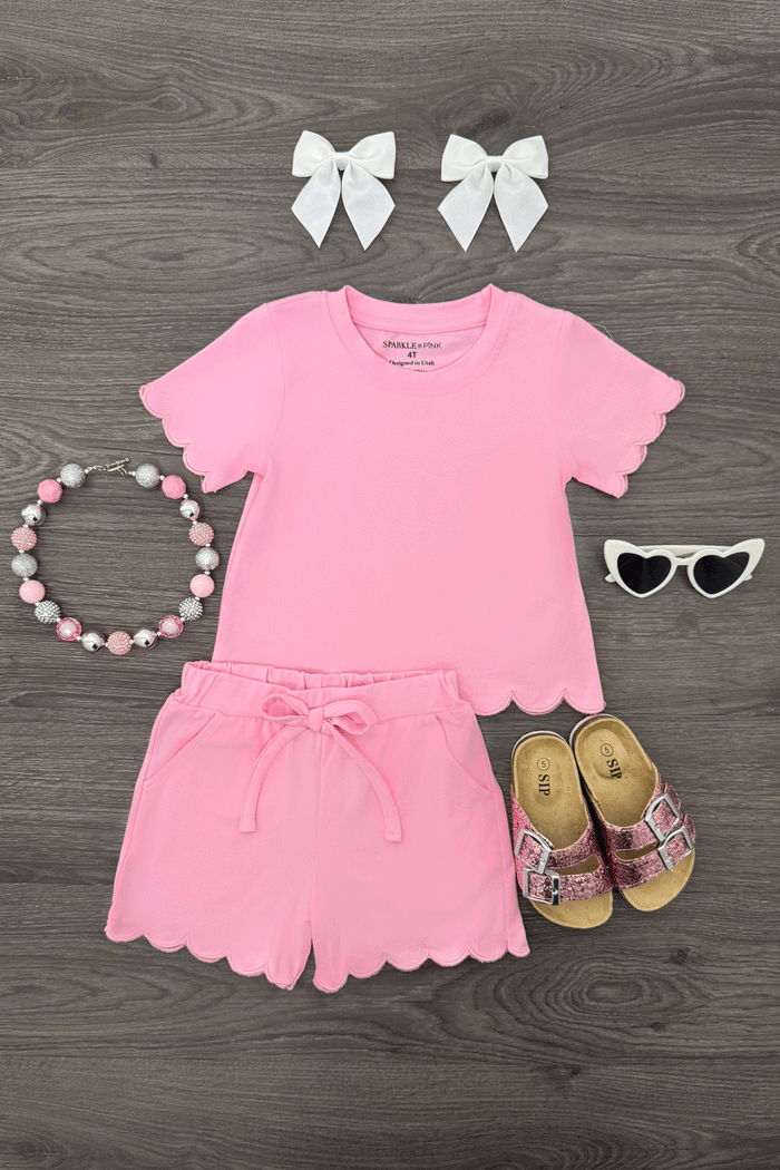 Pastel Short Set - Pink / 6-12 Months - Pink scalloped short set with matching top, paired with white bow clips, beaded necklace, white sunglasses, and floral.