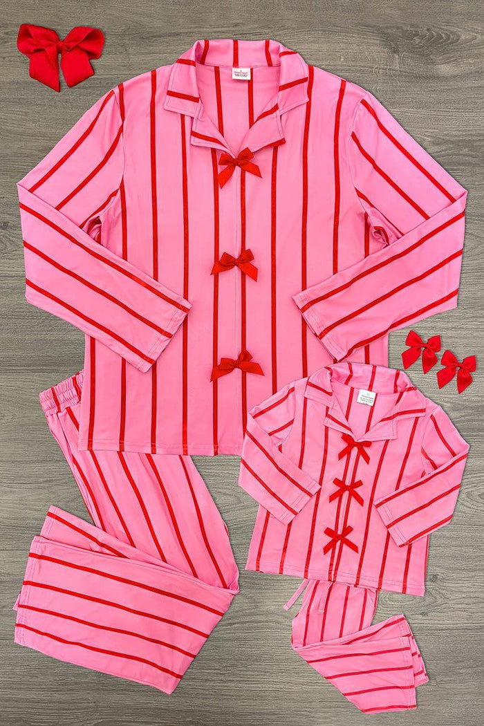 Mom & Me - Pink & Red Stripe Bow Pajamas - CHILD-6-12 Months - Pink pajama set with vertical red stripes, collared long-sleeve top, and matching pants, decorated with red bow accents on.