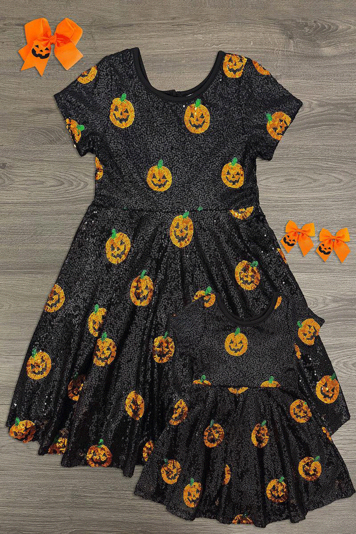 Mom & Me - Black Sequin Jack-O'-Lantern Dress - BABY-6-12 Months - Black short-sleeve dress with glittery fabric featuring orange sequin Jack-O'-Lantern faces and a flared skirt.