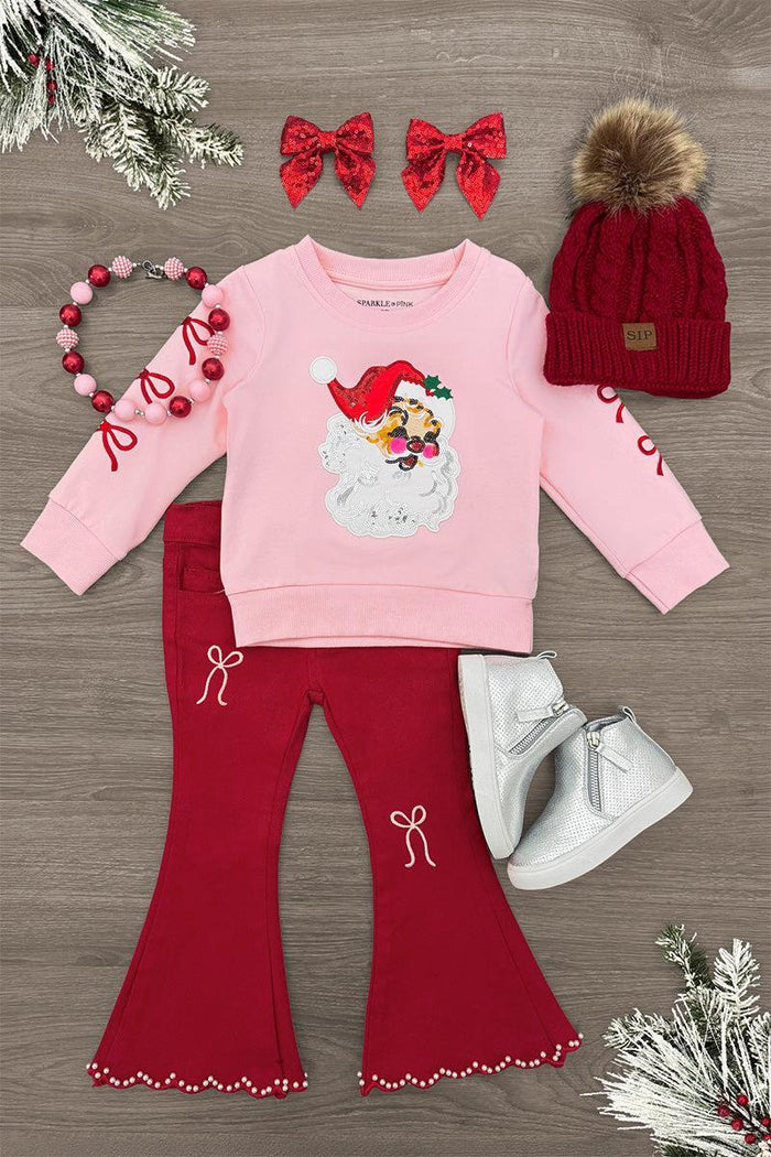 Pink & Red Santa Denim Flare Pant Set - 6-12 Months - Pink long-sleeve sweatshirt with Santa graphic and red flared denim pants with bow details and ruffled hems.