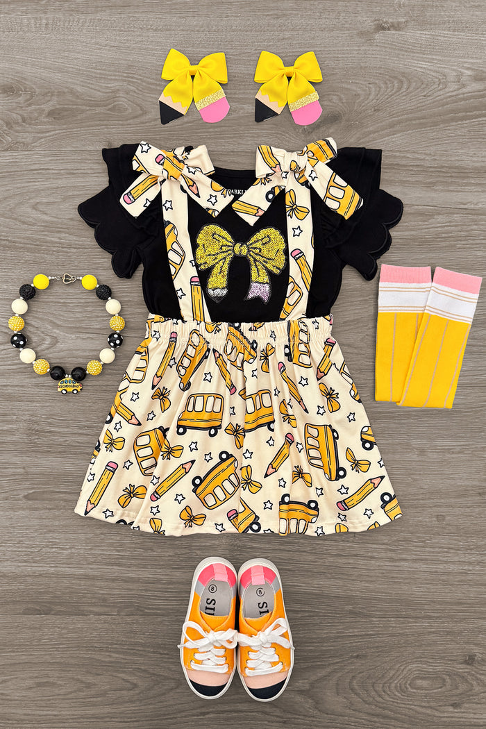 Pencil Bow Suspender Skirt Set - 3T - Black suspender skirt with yellow bow and school bus print, paired with yellow bows, striped socks, beaded bracelet, and.