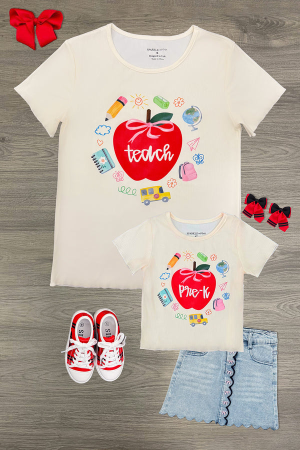 "Teach" Apple Top - MOM-XS - Cream short-sleeve top with red apple graphic and "teach" text surrounded by school-themed icons.