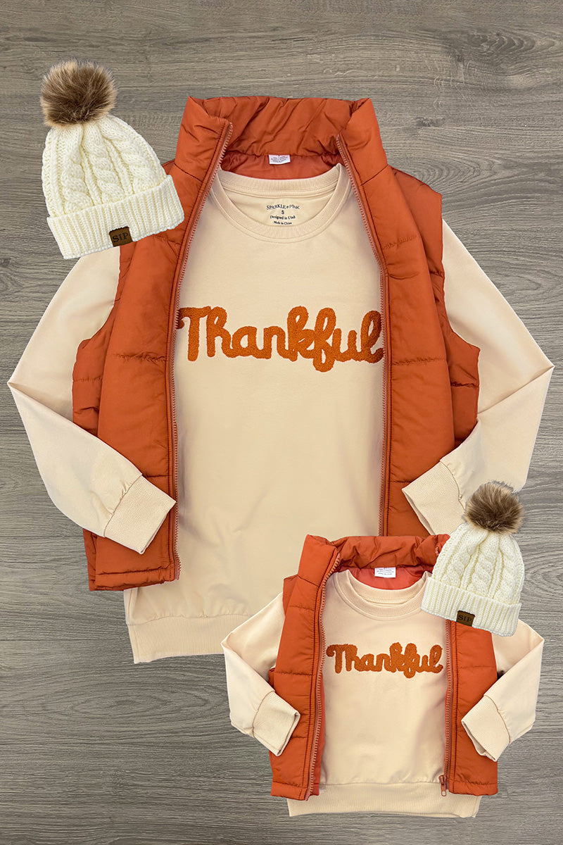 Mom & Me - "Thankful" Vest Set - CHILD-6-12 Months - Tan long-sleeve shirts with "Thankful" in orange script, paired with burnt orange puffer vests and cream knit beanies with.