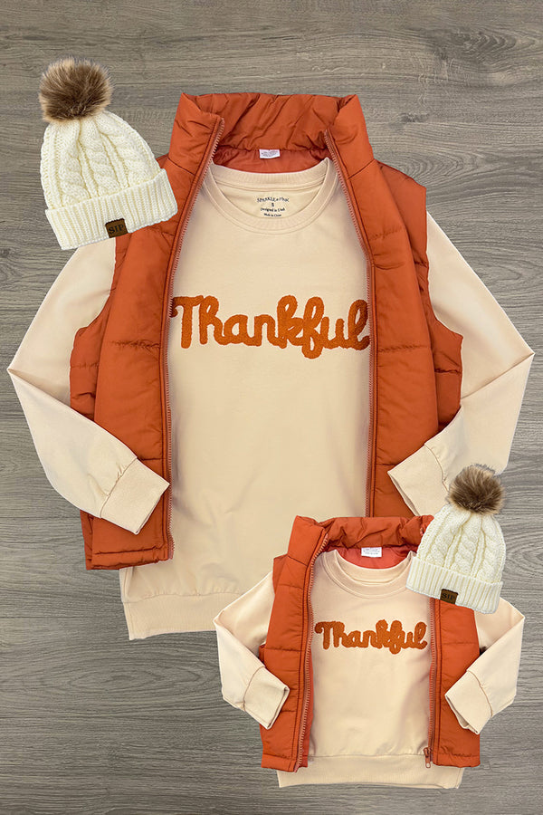 Mom & Me - "Thankful" Vest Set - CHILD-6-12 Months - Tan long-sleeve shirts with "Thankful" in orange script, paired with burnt orange puffer vests and cream knit beanies with.