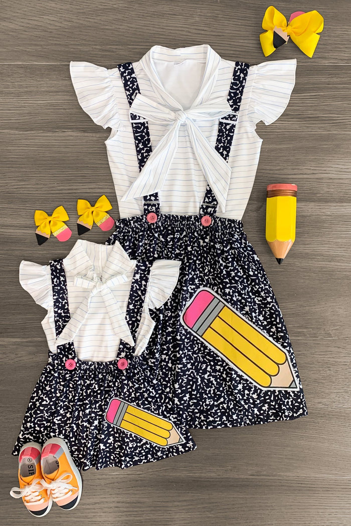 Composition Notebook Suspender Skirt Set - CHILD-2T - Black and white composition notebook print suspender skirts with white ruffled sleeve tops and yellow bow headbands for.