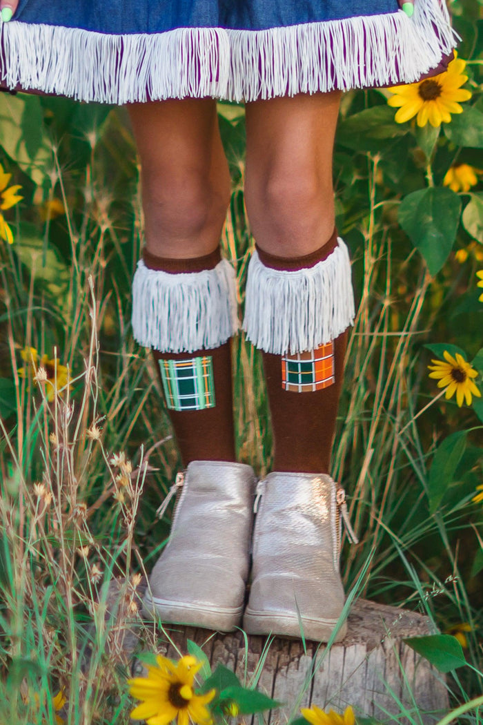 Scarecrow Costume Knee High Socks - Default Title - Brown knee-high scarecrow socks with white fringe and patchwork details worn with silver shoes.