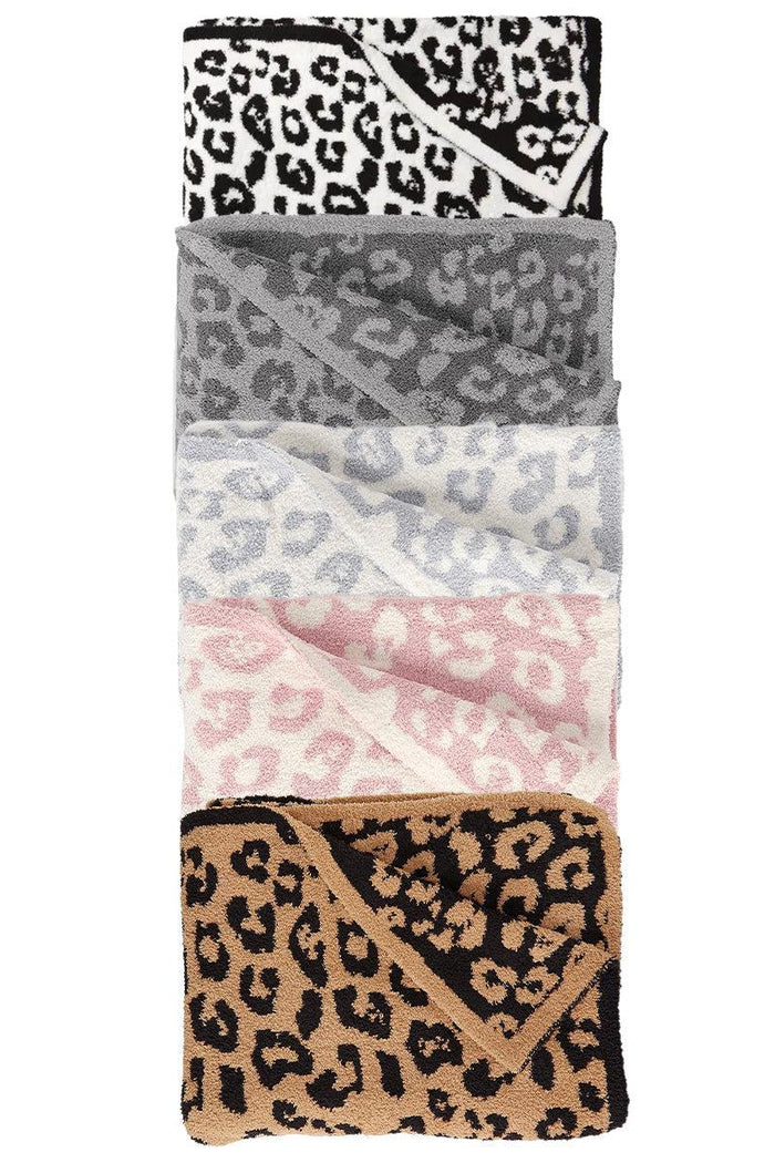 Cozy Leopard Throw Blankets - Baby / Gray and White - Stack of cozy leopard print throw blankets in black and white, dark gray, white and gray, pink and white, and tan and black.