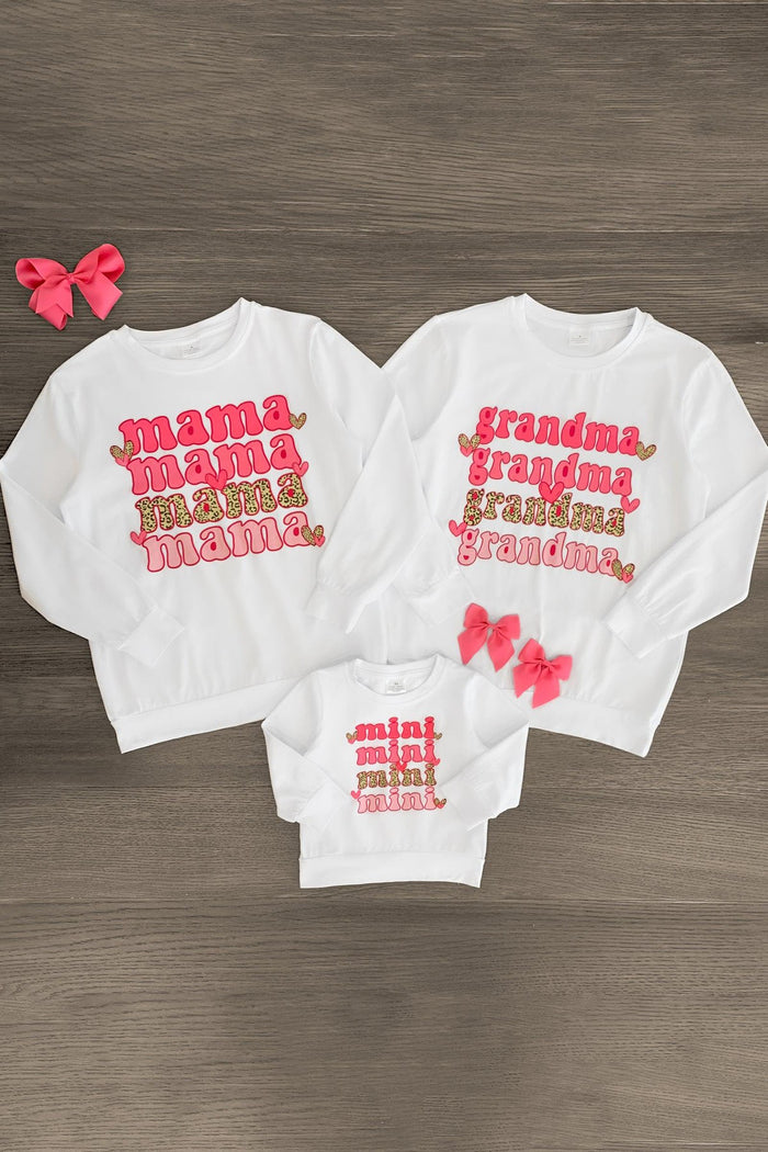 Mom & Me - "Grandma, Mama & Mini" Top - Mini / BABY-0-3 Months-FAMILY - White long-sleeve tops for grandma, mama, and mini with pink and red text designs and matching pink bows.