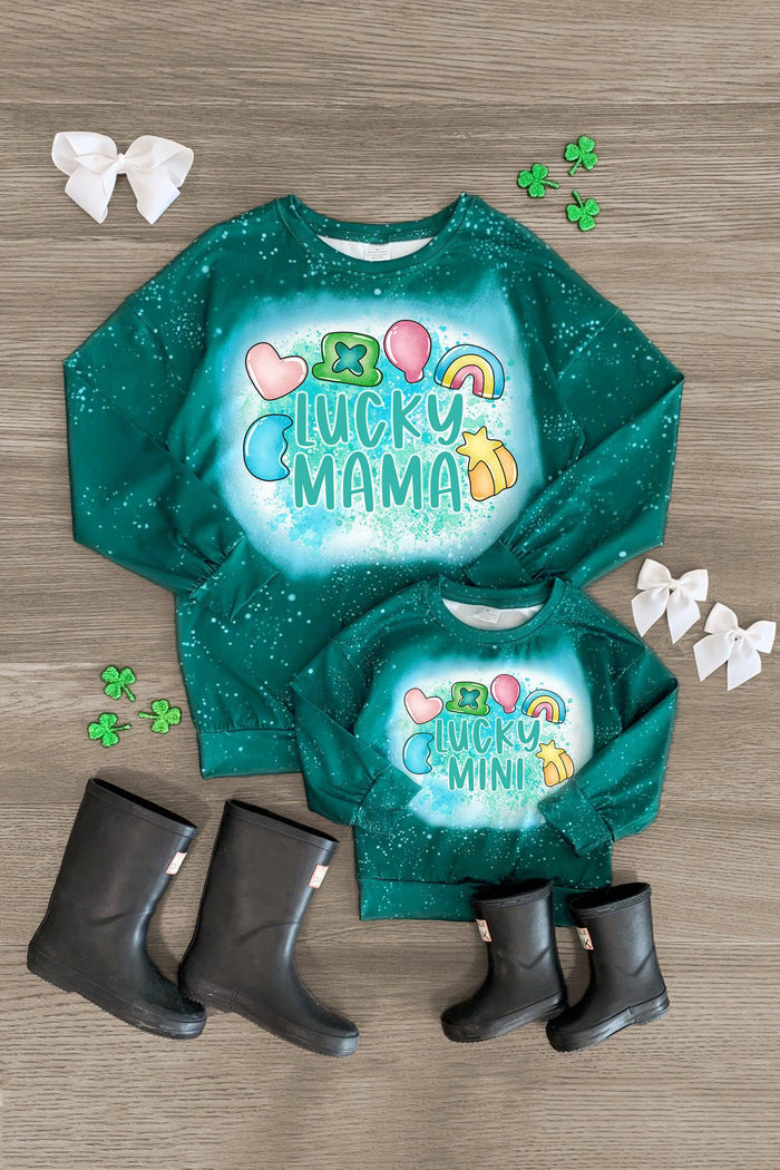 Mom & Me - "Lucky Mama & Mini" Charm Top - CHILD-3XS-6-12 Months - Matching green long-sleeve "Lucky Mama" and "Lucky Mini" tops with shamrock and rainbow charm designs, paired with black.