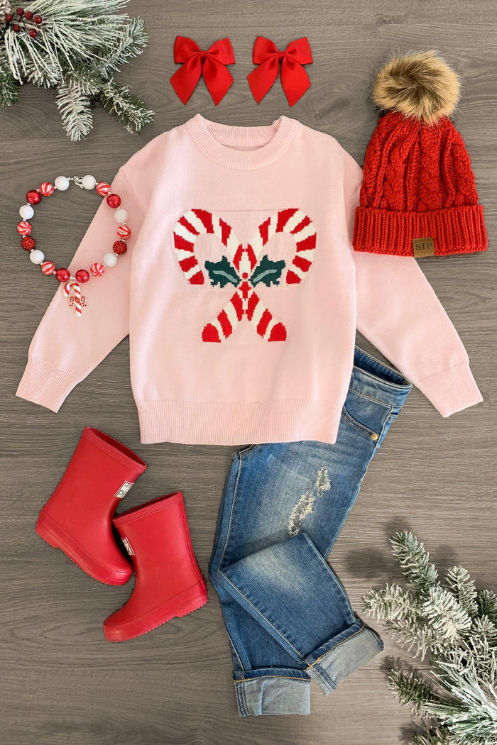 Light Pink Candy Cane Sweater - 3XS-6-12 Months - Light pink sweater with candy cane heart design, paired with red boots, red knit hat with pom-pom, denim jeans, red bows,.