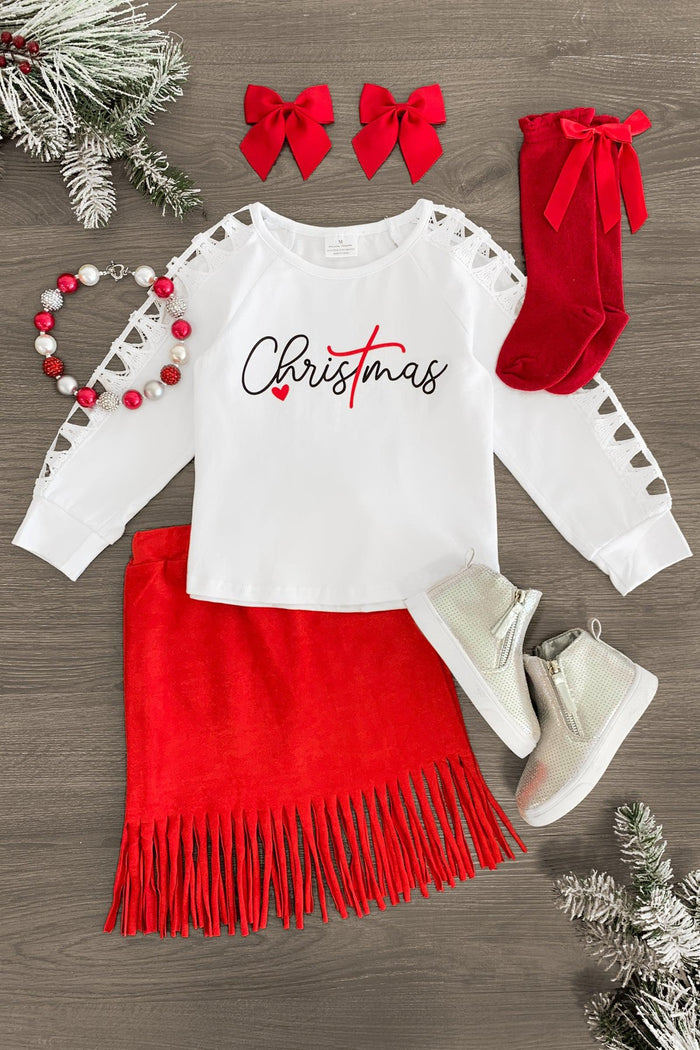 "Christmas" Red Suede Fringe Skirt Set - 3XS-6-12 Months - Toddler Christmas outfit with white long-sleeve shirt featuring "Christmas" text, red suede fringe skirt, red bow hair.