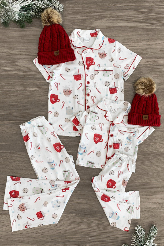 Mom & Me - Cookies & Hot Cocoa Pajamas - CHILD-3XS-6-12 Months - Matching white cotton pajamas with red heart, cookie, and hot cocoa cup prints, featuring red piping and buttons, paired.
