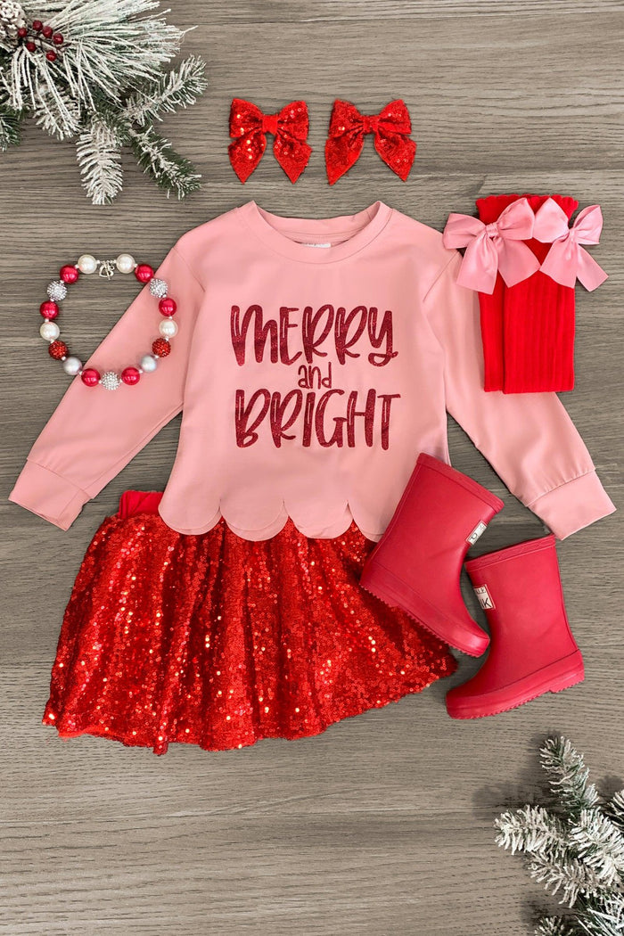 "Merry & Bright" Red Sequin Skirt Set - 3XS-6-12 Months - Pink long-sleeve shirt with "Merry & Bright" text paired with red sequin skirt and matching red boots, two red sequin bows,.