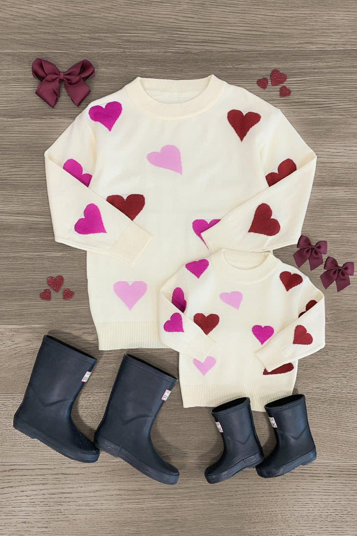 Mom & Me - Cream Heart Sweater - BABY-0-3 Months-FAMILY - Cream sweater with pink and red heart prints in adult and child sizes paired with black rain boots and burgundy hair bows on .