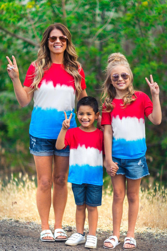 Mom & Kid - Patriotic Firecracker Ombre Top - BABY-6-12 Months-FAMILY - Red, white, and blue ombre tie-dye top with short sleeves worn by woman and two kids outdoors.