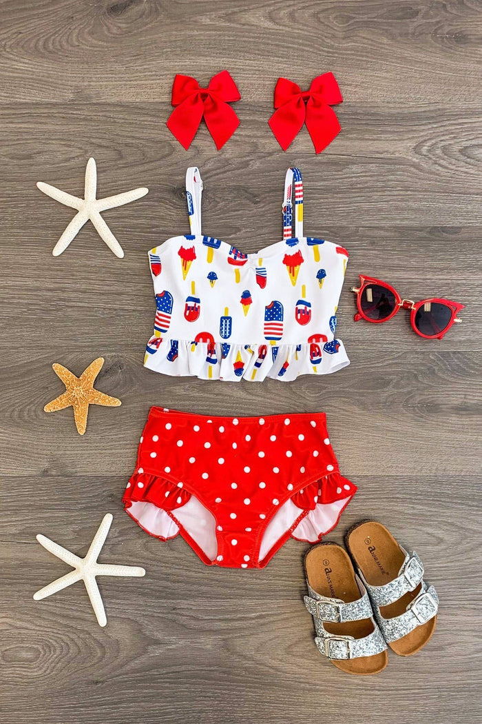 Patriotic Popsicle High-Waisted Swimsuit Set - 6-12 Months - Toddler swimsuit set with patriotic popsicle print top, red polka dot high-waisted bottoms, red bows, red sunglasses, and.