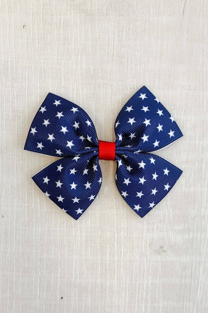 Red, White, & Blue Star Bow - Default Title - Navy blue bow with white stars and a red center band on textured background.