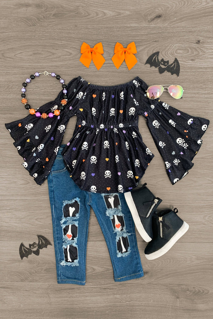 Skeleton Bones Denim Pant Set - 3XS-6-12 Months - Black off-shoulder top with white skeleton print and flared sleeves, distressed blue denim jeans with skeleton patches,.