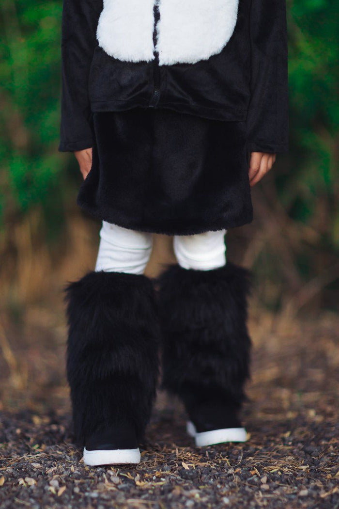White Leggings - XXS-12-18 Months - White leggings paired with black faux fur leg warmers on a child outdoors.